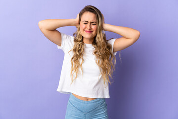 Young Brazilian woman isolated on purple background frustrated and covering ears