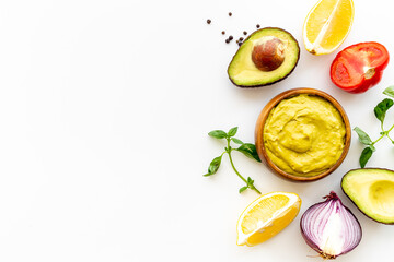 Spicy guacamole avocado dip with herbs and tomatoes