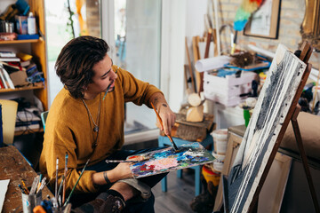 man painter working in his atelier