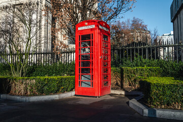 Red telephone box. Traditional iconic booth or kiosk in London, England, United Kingdom.
