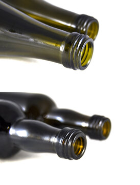 Wine bottle on white background close-up. Glass, vessel, neck, wallpaper, background, texture, alcoholism
