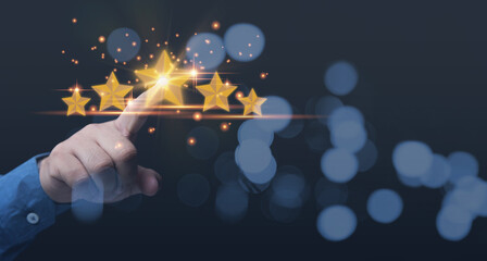 Customer satisfaction assessment. service business, evaluation, satisfaction, customer acceptance. Businessman using hand touching point on star rating 5 stars showing the highest satisfaction.