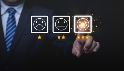 Young businessman touching screen at smile. Gets the highest customer satisfaction. Service, business, evaluation, customer acceptance, credibility, business service.