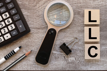 Limited Liability Company LLC Business Concept Background. text on wooden blocks near black...