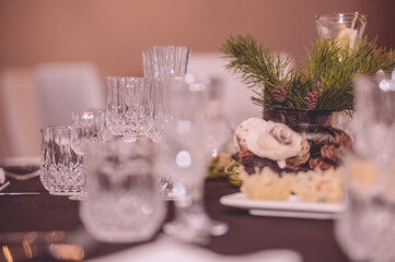 Empty crystal glasses on house dinner table. Restaurant, banquet setting with crystal glasses