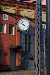 Fototapeta na wymiar big clock in the tram depot, historical building
