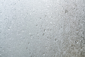 raindrops on steamed window in a rainy day