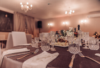 Restaurant table set up. Empty crystal glasses on house dinner table. Restaurant, banquet setting with crystal glasses