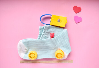creative, lovely, cute car out of sock. small bear toy is travelling on the sock