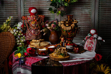 pancakes on a white plate. on the pancakes - a piece of butter. black sturgeon and red salmon caviar are served with pancakes on Shrovetide
