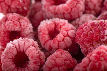 Berries background - Frozen raspberries covered with hoarfrost. Summer berries,