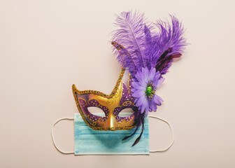 Concept of carnival during covid-19. Venetian carnival mask with protective surgical mask. Carnival celebration concept