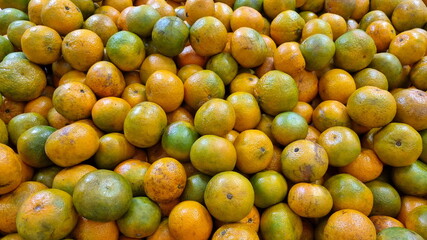 Fresh clementines on shelf for sale at market. Food for good health.
