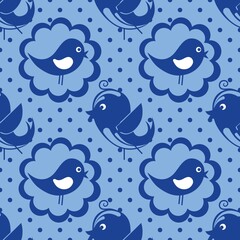 Cartoon seamless background in blue and white for kids. Seamless texture tile with vintage motives...Cheerful regular pattern for children with birds. Blue and white design for printing.
