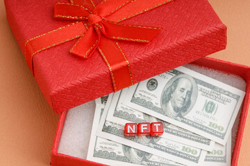non fungible token is abbreviated NFT blockchain in a gift box many dollars
