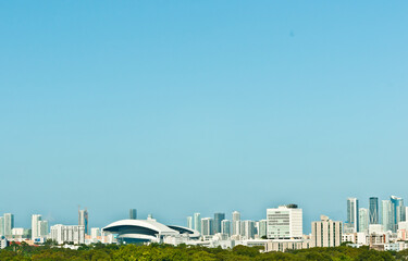 front view, far distance of the skyline of Miami at midday, on a cool, tropical morning