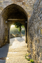 Sunset at the gates of a medieval wall