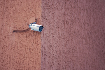 Photo of a security camera on a building. Creation of security.