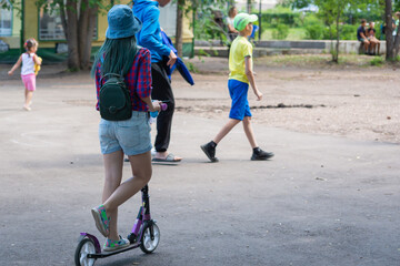Children play in the summer on the playground.