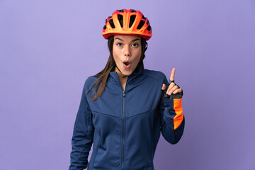 Teenager cyclist girl intending to realizes the solution while lifting a finger up