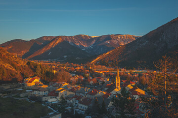 A panoramic wide landscape view of Veynes, an old town in the French Alps, during the sunset