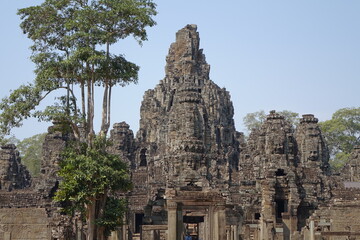 Adventure of exploring mystic Bayon temple in the impressive Khmer ruin city Angkor Thom...