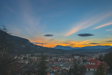 A panoramic wide landscape view of Veynes, an old town in the French Alps, during the sunset