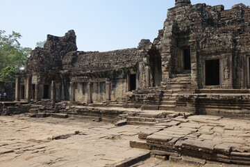 Adventure of exploring mystic Bayon temple in the impressive Khmer ruin city Angkor Thom...