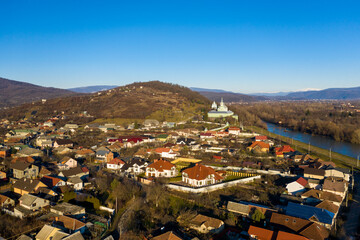 The Mukachevo city at the evening with beautiful mountains panorama aerial view