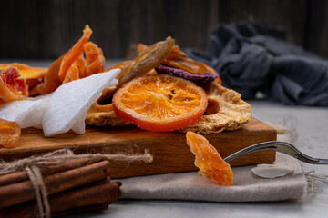 fruit chips. Dried fruits on a wooden board.