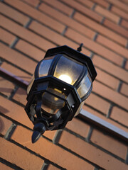 vintage street lamp on a brick wall