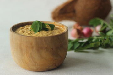 Coconut chutney. Spicy condiment made of fresh coconuts, red chilies and shallots. Served in a...
