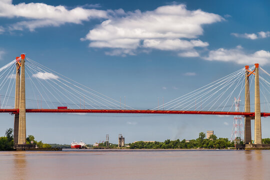 Zarate suspension bridge (Argentina) with cargo ships in the background