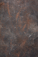 The texture of the copper and bronze metal background is covered with a patina and rust.  Metallic...