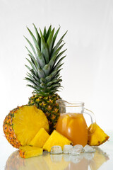 pineapple lies on a bright background. Fresh juicy tropical yellow fruit