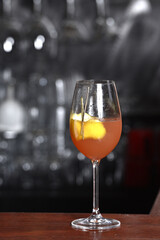 drinks tropical citrus fruits over ice, with sprigs of herbs, grants space for text in blurred background