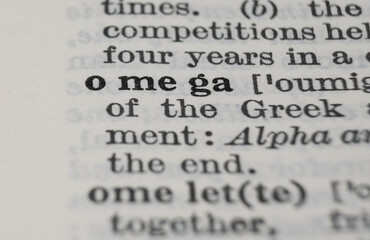 Greek letter Omega dictionary definition close-up, shallow depth of field.
