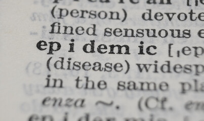 Obraz premium Epidemic dictionary definition close-up. Shallow depth of field.