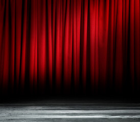 Empty wooden stage and closed red curtains