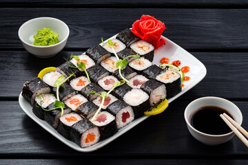 Classic Japanese sushi roll hosomaki with tuna, salmon and shrimp