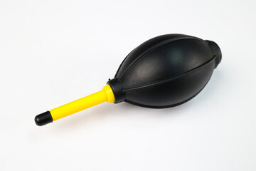 A Manual Hand Air Blower isolated on a White Background, This blower is generally used to clean dust from the DSLR or Mirrorless cameras and, Lenses.