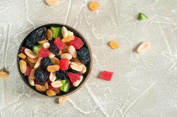 Top view of healthy dried fruits of different colors and nuts. Flat lay, selective focus with copy space