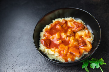 mashed potatoes tomato sauce roast sausage healthy meal food snack on the table copy space food background rustic top view 