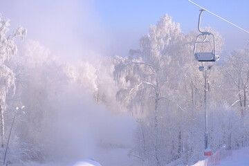 Snow-covered trees in hoarfrost at a ski resort, lift, funicular, ski lift

