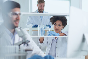 Obraz premium Team of Medical Research Scientists Working on Generation Experimental Drug