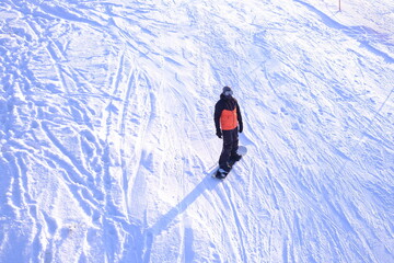 Slope, skier going down the slope