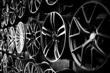 Fotobehang Car alloy wheels in a store, selective focus © Natalia