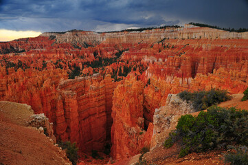 Moody, stormy late summer afternoon view of rock spires and hoodoos from Sunset Point, Bryce Canyon National Park, Utah, Southwest USA