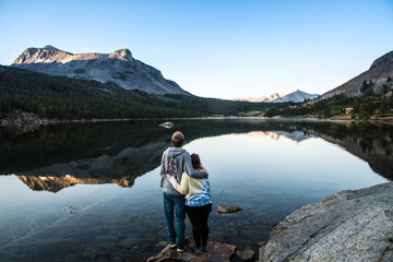 Fototapeta premium Couple In Love Watching Mountain Sunrise in Yosemite National Park After Hike
