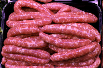 Raw Italian sausage ready to be cooked. Meat for sale in the butcher's shop